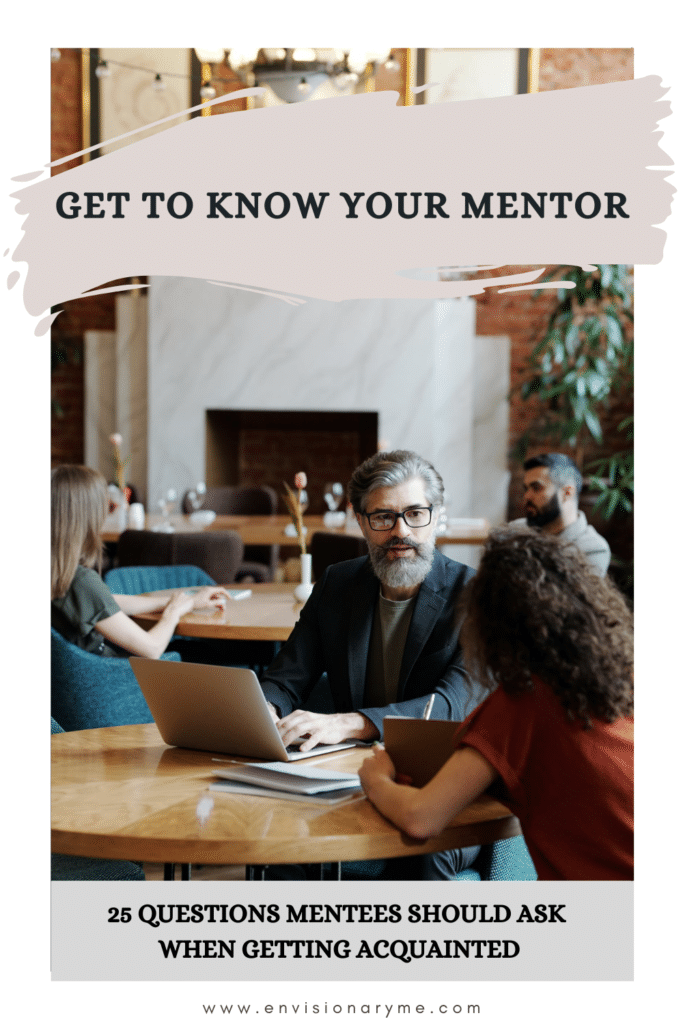 25 Questions To Ask A Mentor When Getting Acquainted. EnvisionaryME article header image with an older male working on his laptop talking to his student.