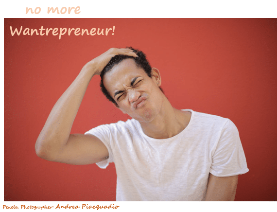 Image of young male with red background and words no more Wantrepreneur!