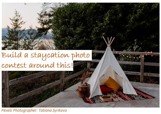 Staycation image of tipi on back patio with words "Build a staycation photo contest around this!