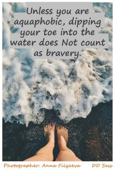 Image of feet in the water ocean waves. with text Unless you are aquaphobic, dipping your tow into the water does Not count as bravery.