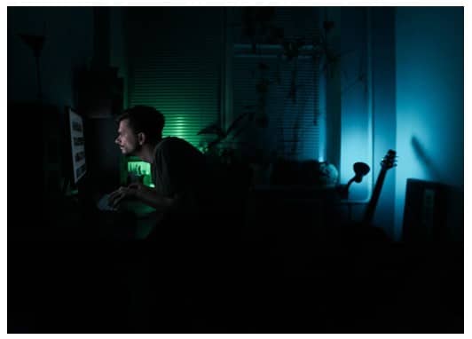 entrepreneur male working at night in his home office
